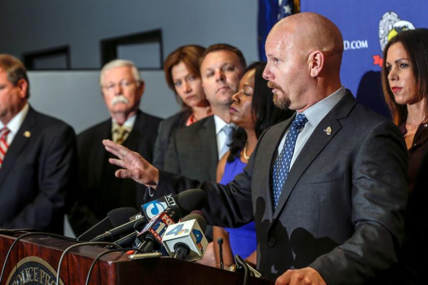 Jamie McBride, a Los Angeles police detective and a director of Los Angeles Police Protective League, speaks at a news conference last year. A jury awarded McBride $1.5 million in his lawsuit alleging he was the victim of retaliation by the department.