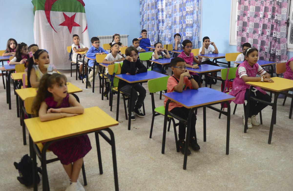Schoolchildren at their desks in class