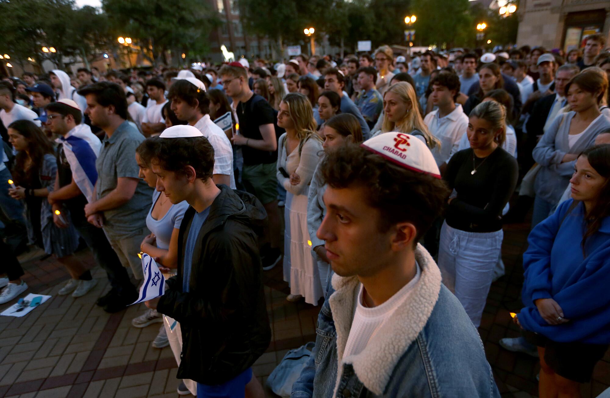 USC students attend an evening vigil on campus in support of Israel.  