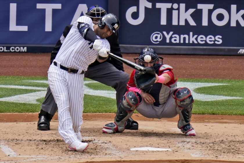 New York Yankees' Aaron Hicks hits an RBI-single during the third inning of a baseball game against the Washington Nationals at Yankee Stadium, Sunday, May 9, 2021, in New York. (AP Photo/Seth Wenig)