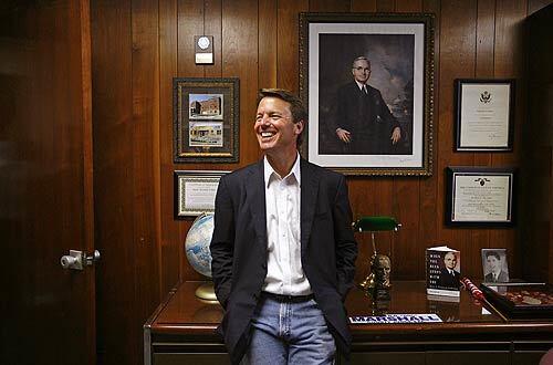 John Edwards relaxes inside a Kentucky courthouse after another of his "Two Americas" speeches on poverty in July. The location was no accident. Nearly 40 years earlier, Robert Kennedy spoke to the people of Prestonsburg about the same issue.