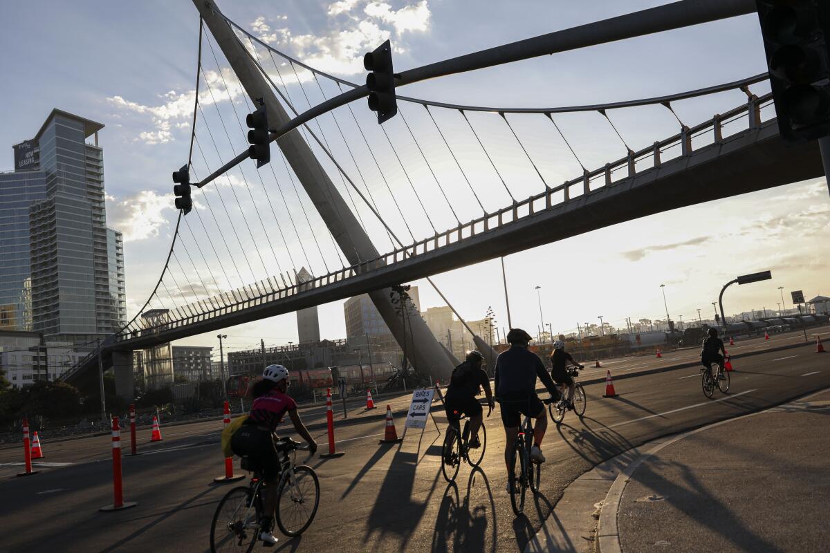 \Riders pedal along Harbor Blvd Bridge during the 16th Annual Bike the Bay on Sunday, August 24, 2023.