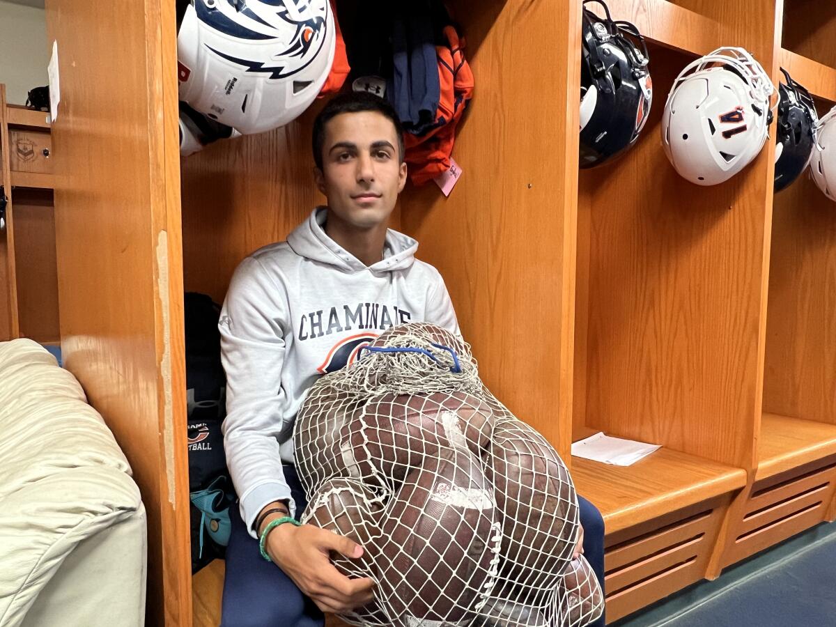 Chaminade kicker and punter Ryon Sayeri poses for a photo in the school's locker room.