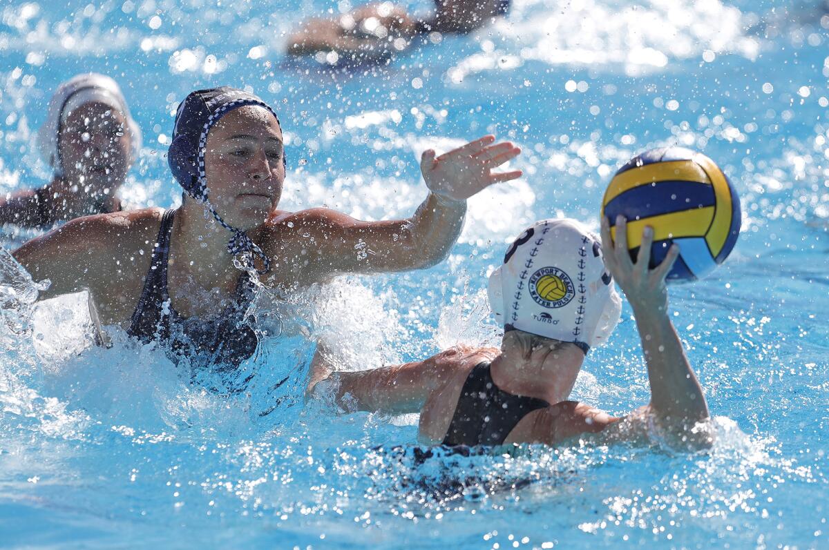 Newport Harbor's Avery Montiel, left, defends against San Diego Shores during the Summer Invite hosted on Friday.