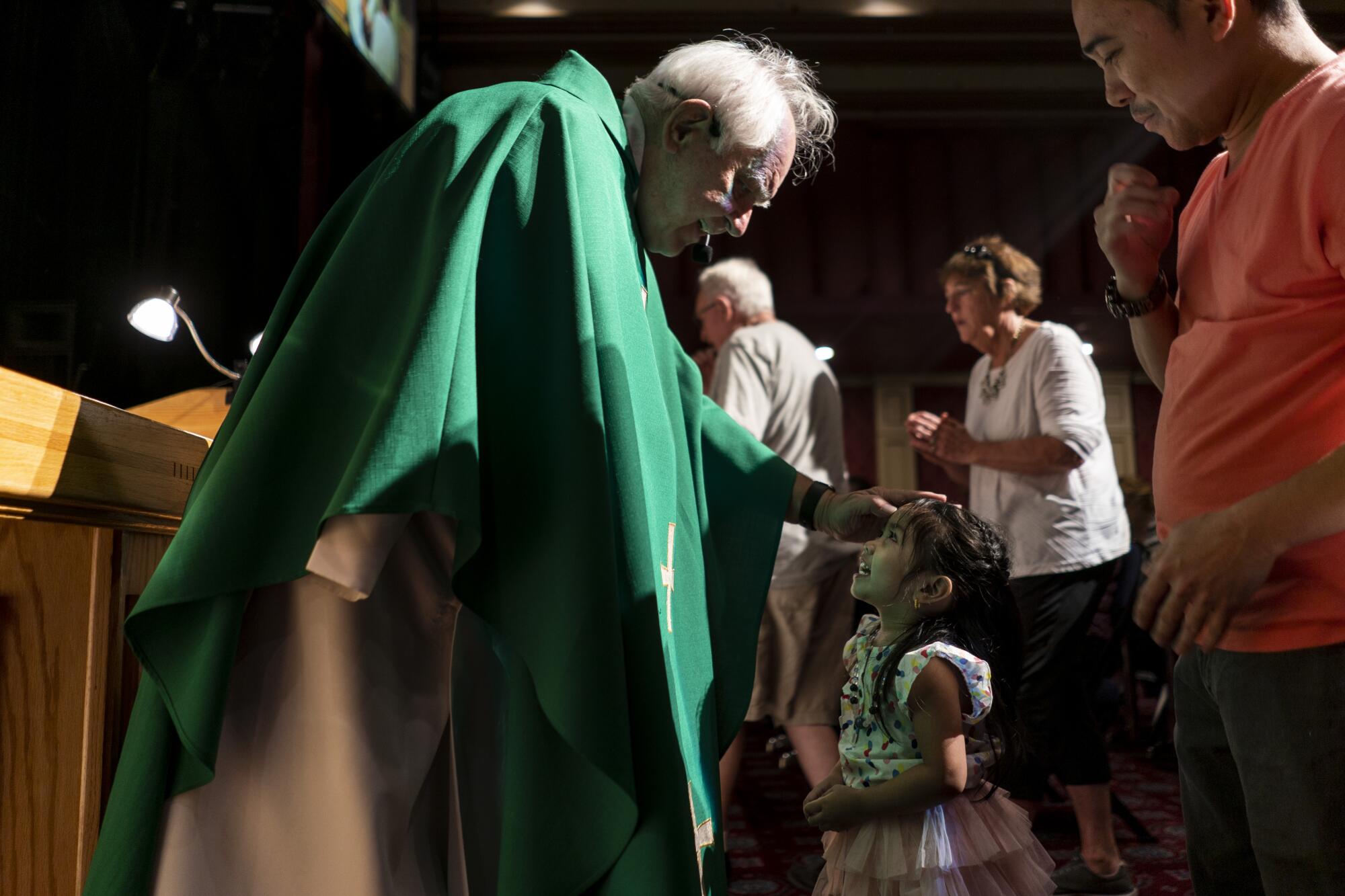 Father Charles Urnick greets visitors