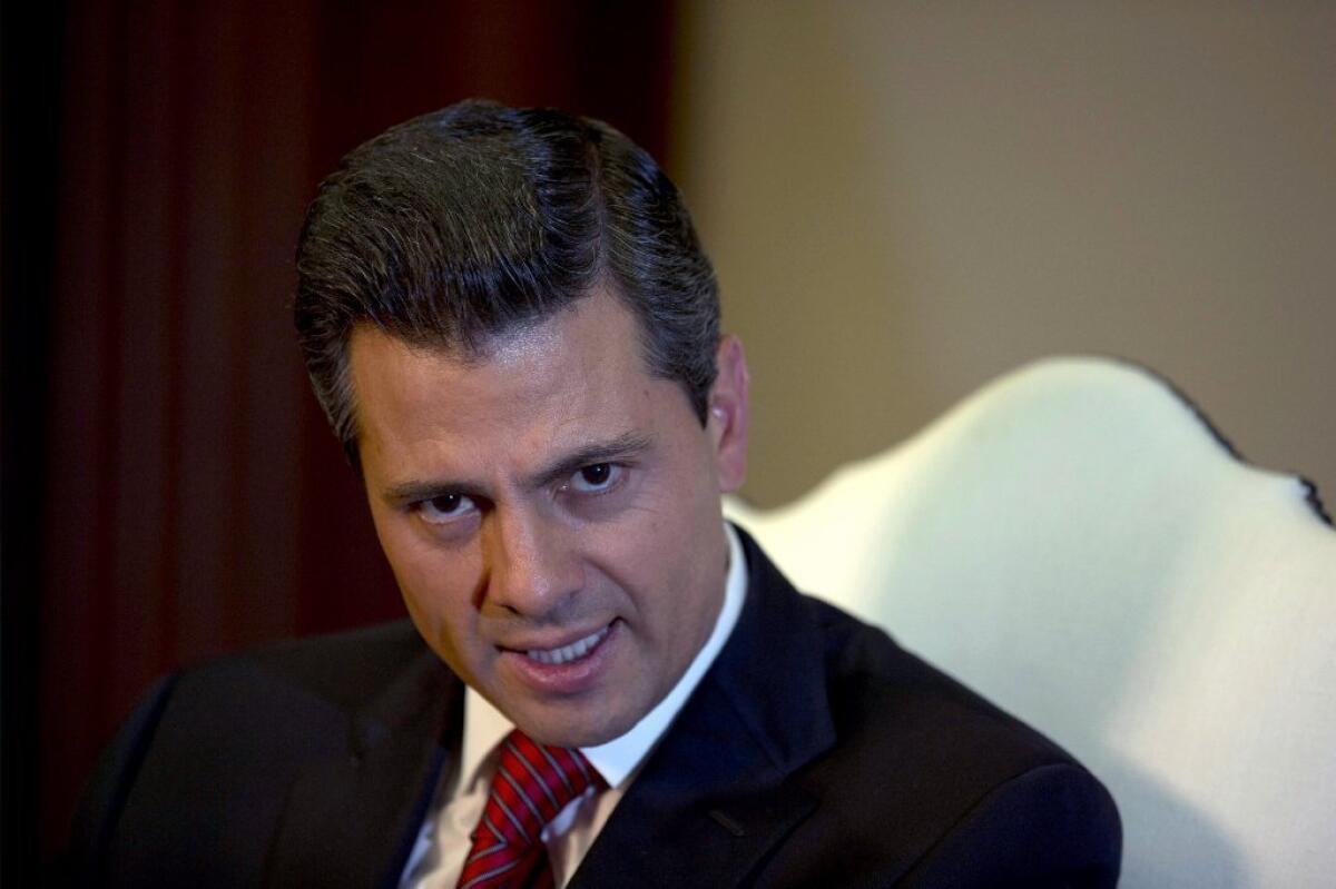 Enrique Pena Nieto speaks during an interview at the Los Pinos presidential residence in Mexico City. A top aide says that surgery to remove a thyroid nodule went smoothly.