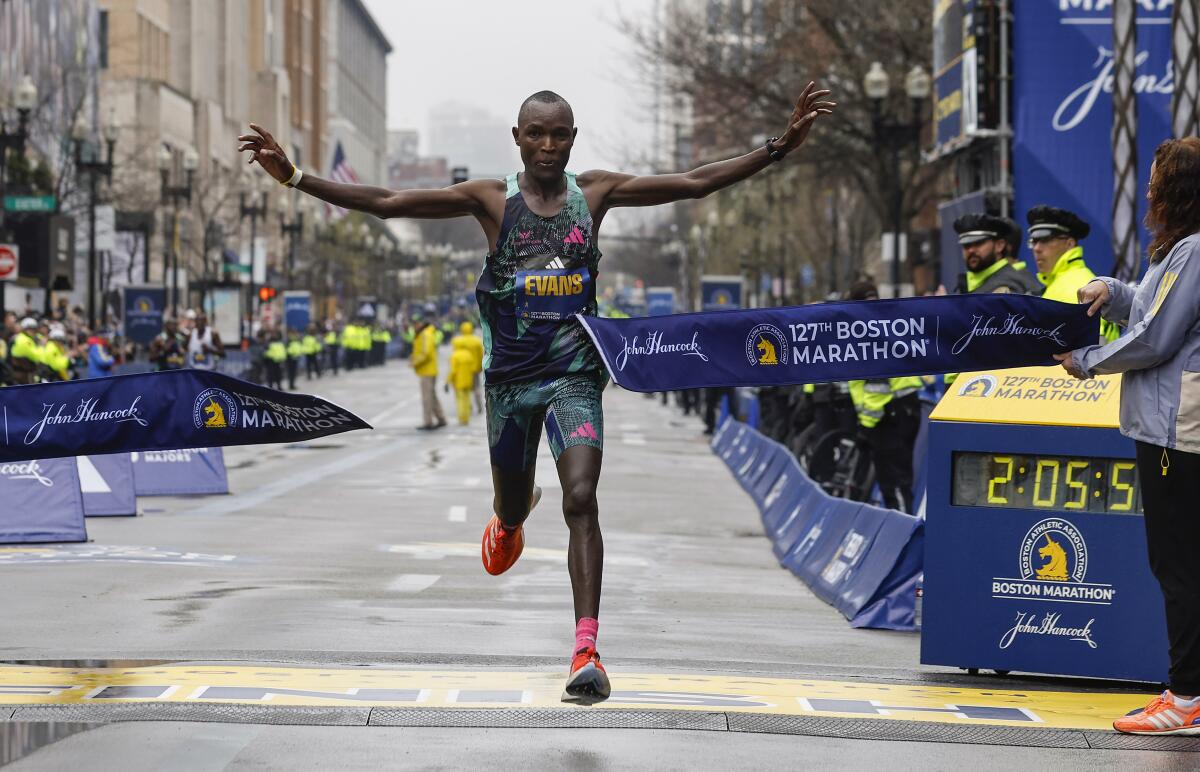 Evans Chebet of Kenya breaks the tape to win the 127th Boston Marathon, Monday, April 17, 2023