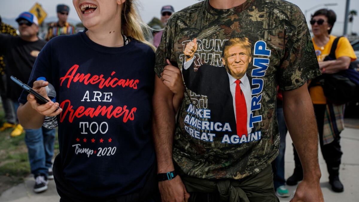 Counter-protesters sport political attire during President Trump's visit to San Diego.