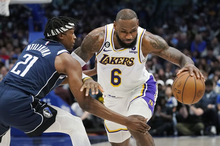 Los Angeles Lakers forward LeBron James (6) drives against Dallas Mavericks guard Frank Ntilikina.