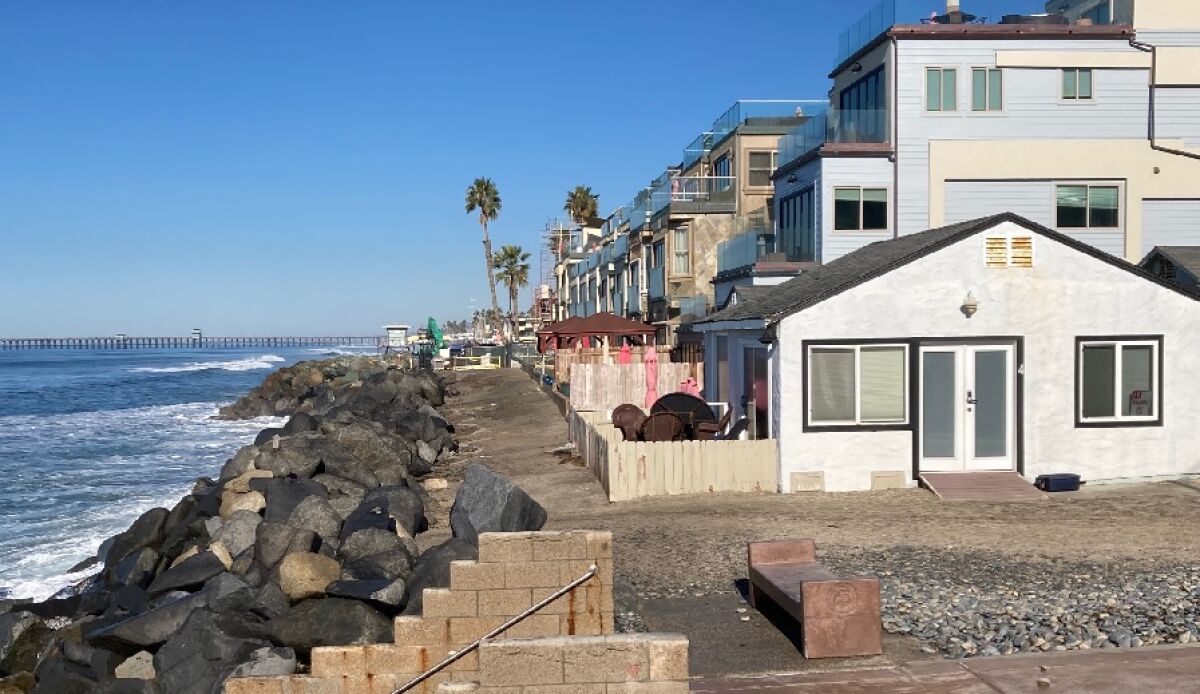 A rock revetment in need of repair lines the beach along South Pacific Street in Oceanside.