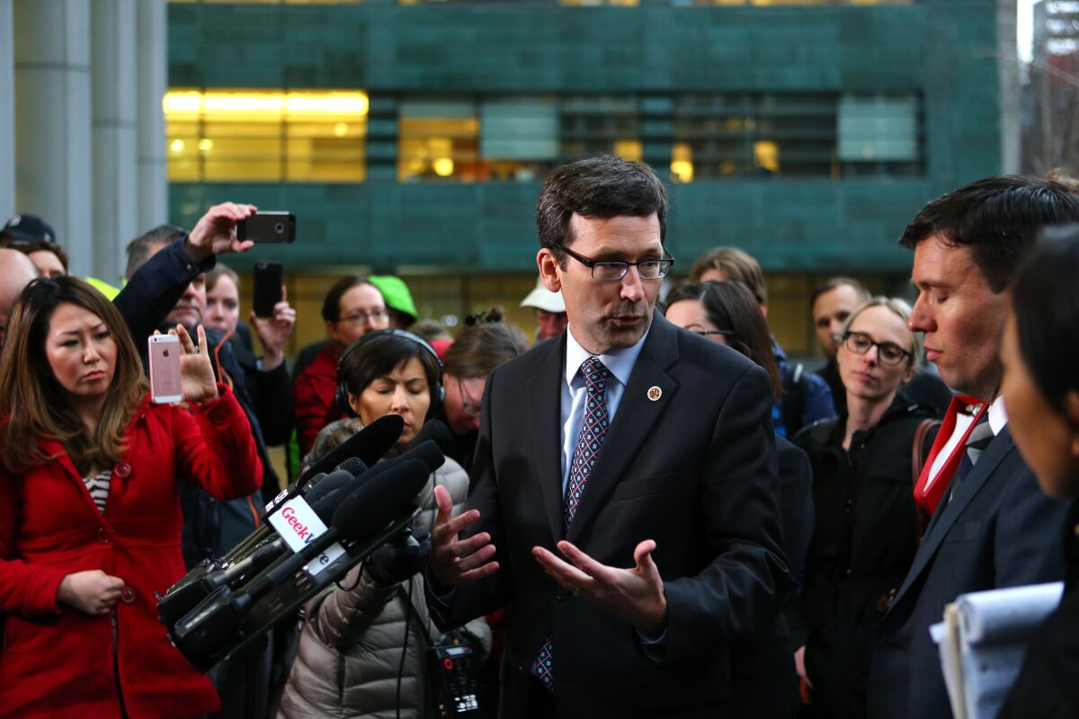 Washington Atty. Gen. Bob Ferguson announces the filing of a state lawsuit on Feb. 3, 2017, challenging key sections of President Trump's travel ban as unconstitutional.