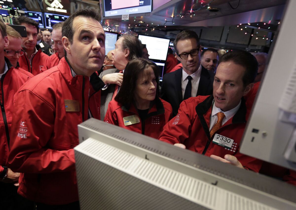 Lending Club founder and then-CEO Renaud Laplanche, left, is seen at the New York Stock Exchange the day of the company's IPO in 2014.