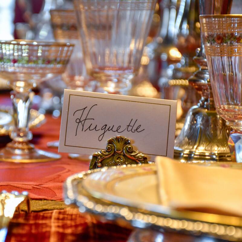 The dining room, set with dinnerware.