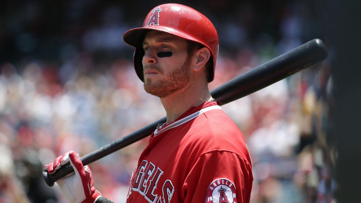 Angels outfielder Josh Hamilton looks on during an at-bat against the Seattle Mariners on Sunday. Hamilton has been limited to designated hitter duty in recent games because of discomfort in his legs.