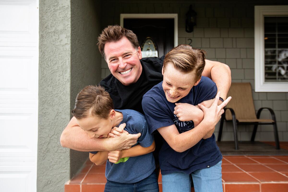 Bob Waeger, 41, and his sons, Jack, 11, and Cooper, 8, in the backyard of their Long Beach home.