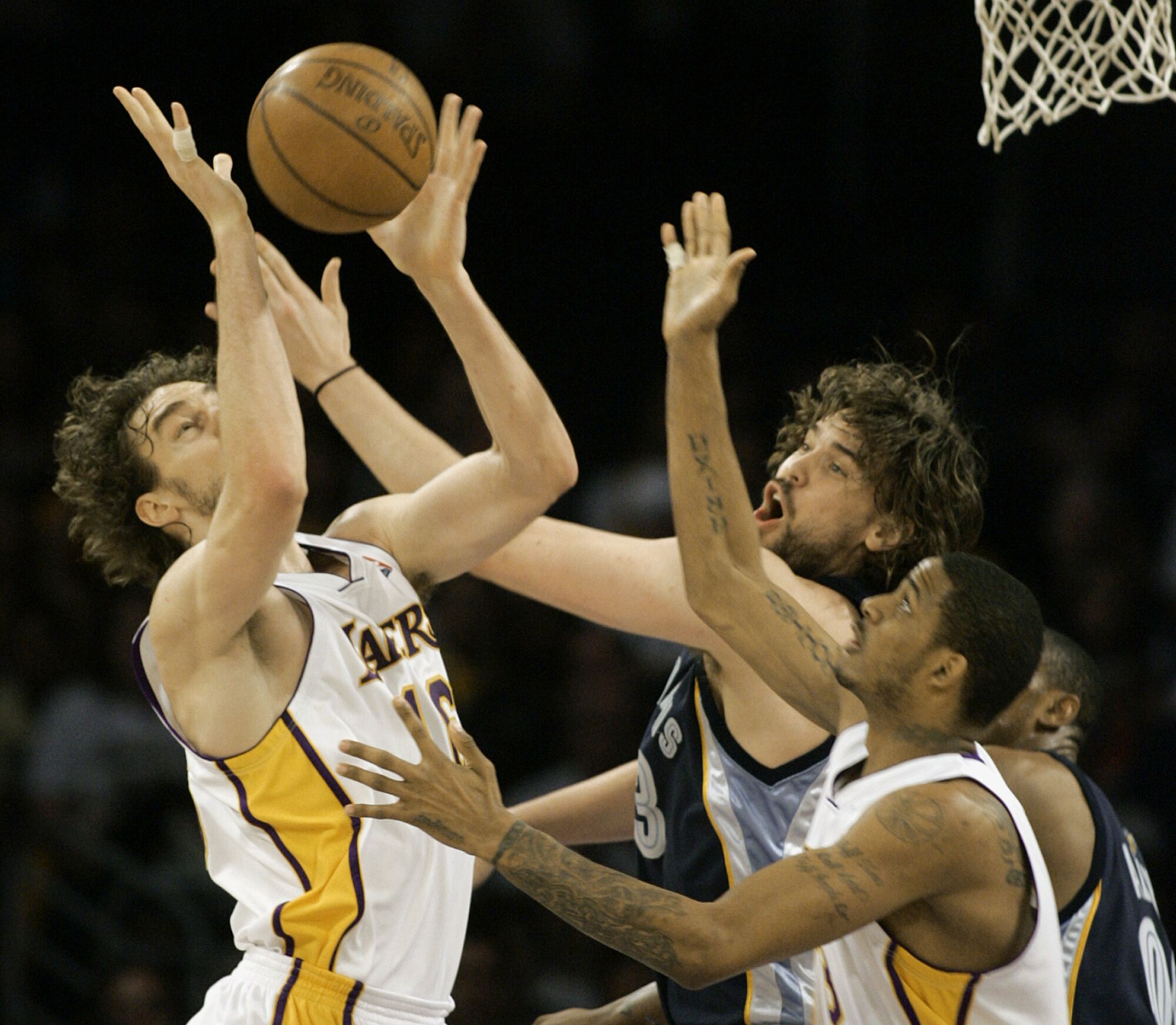 Lakers forward Pau Gasol (left) battles for a rebound against his brother, Grizzlies center Marc Gasol.