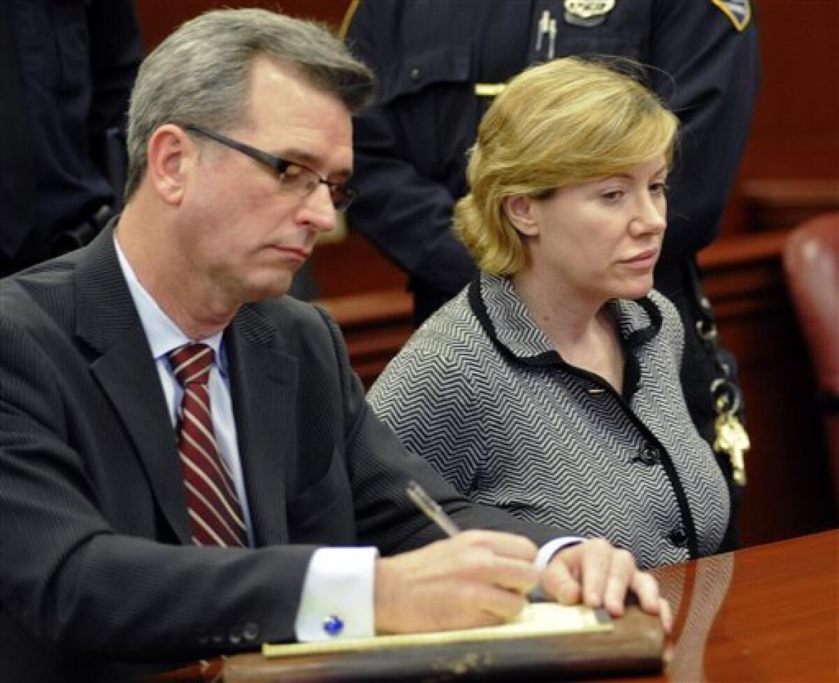 Anna Gristina, who has been charged with promoting prostitution, appears in State Supreme Court with her attorney Peter Gleason, Monday, March 12, 2012, in New York. A judge is expected to examine her finances to see whether she should continue to get a court-paid defense. (AP Photo/Louis Lanzano)