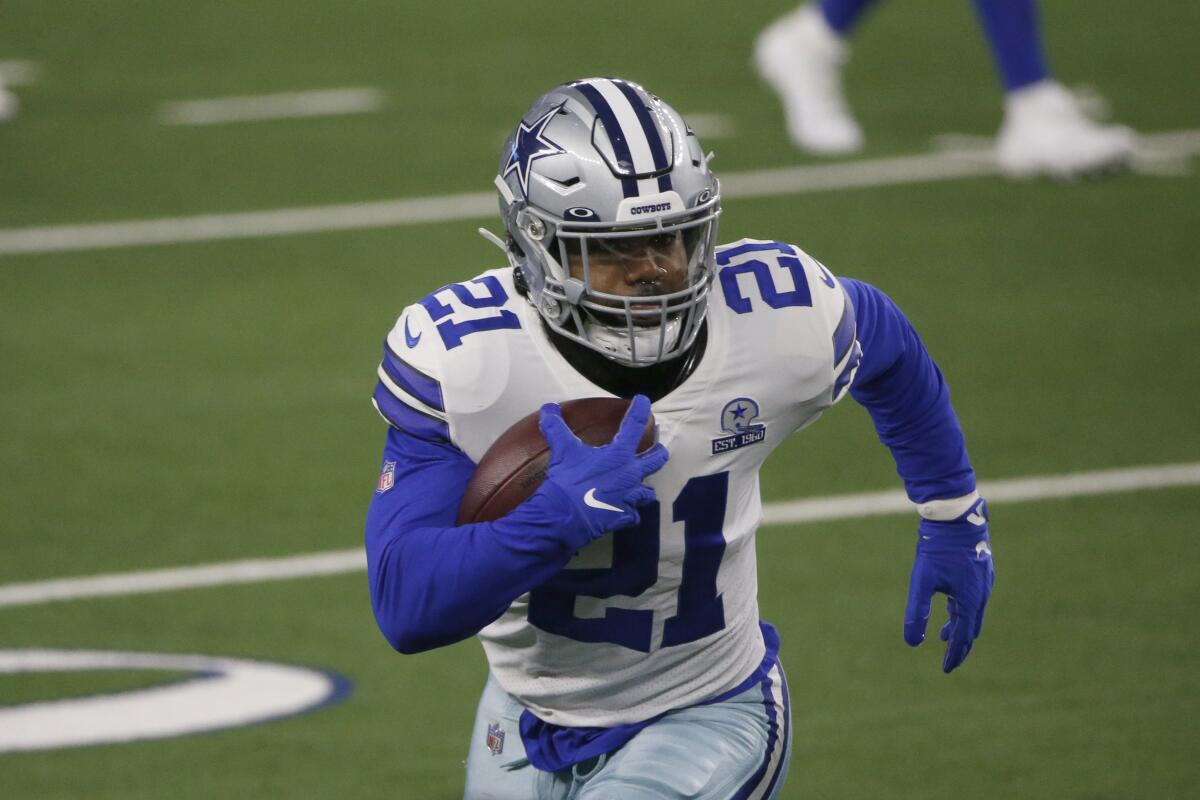 Dallas Cowboys running back Ezekiel Elliott runs after a reception against the Arizona Cardinals.