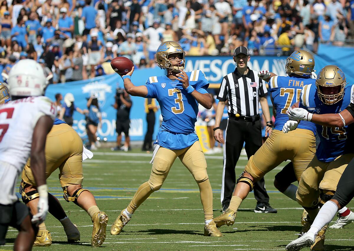 UCLA quarterback Dante Moore throws during the second quarter of a 25-17 win over Washington State at the Rose Bowl.