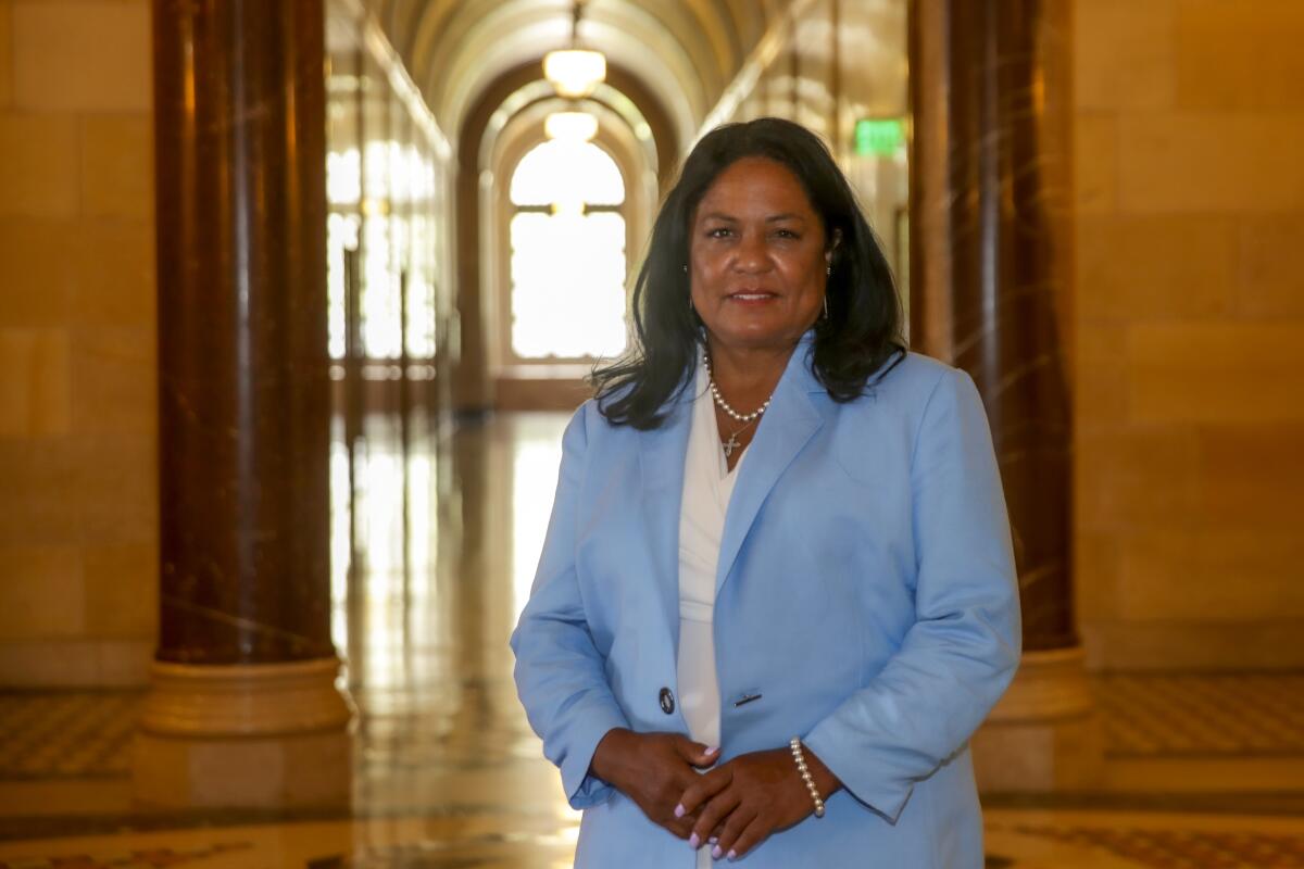 A woman in a blue suit at City Hall 