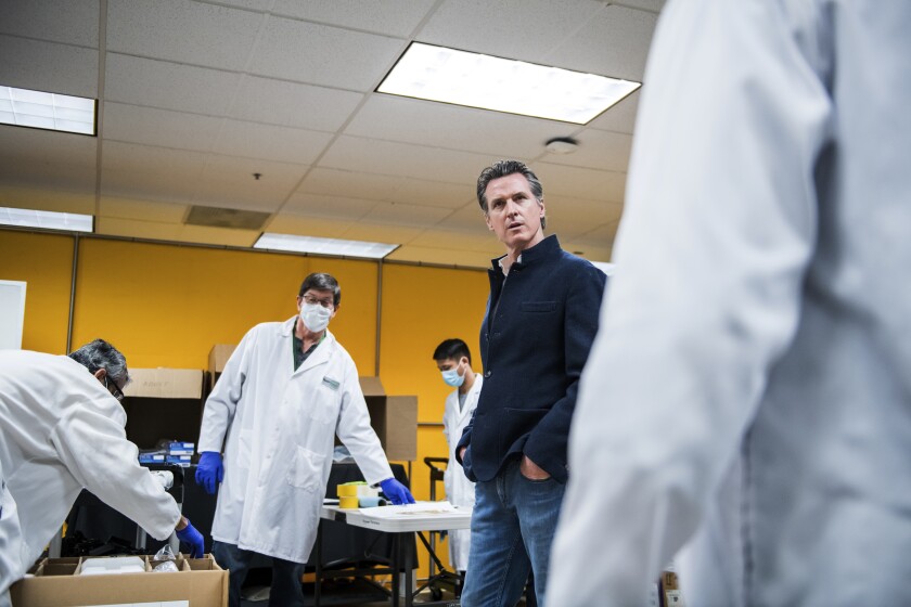 California Gov. Gavin Newsom on Saturday tours the Bloom Energy company in Sunnyvale that has converted part of its factory from making fuel cells to refurbishing ventilators.