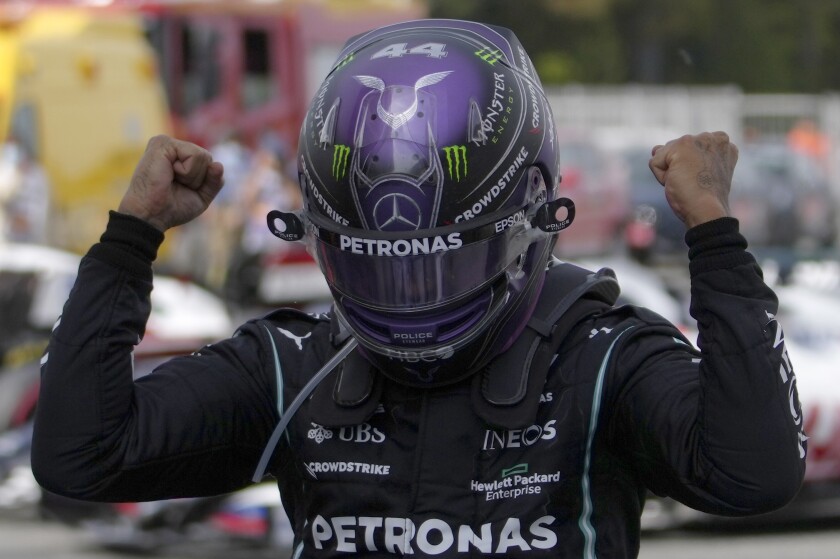 Mercedes driver Lewis Hamilton of Britain celebrates after winning the Spanish Formula One Grand Prix at the Barcelona Catalunya racetrack in Montmelo, just outside Barcelona, Spain, Sunday, May 9, 2021. (AP Photo/Emilio Morenatti, Pool)