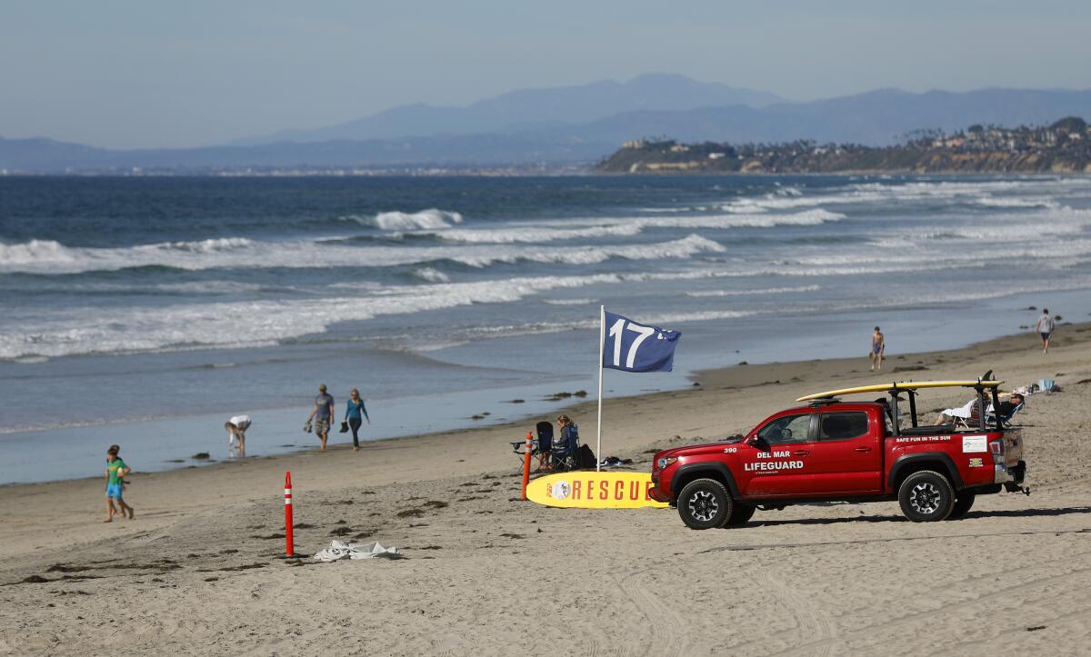 A lifeguard truck on a beach