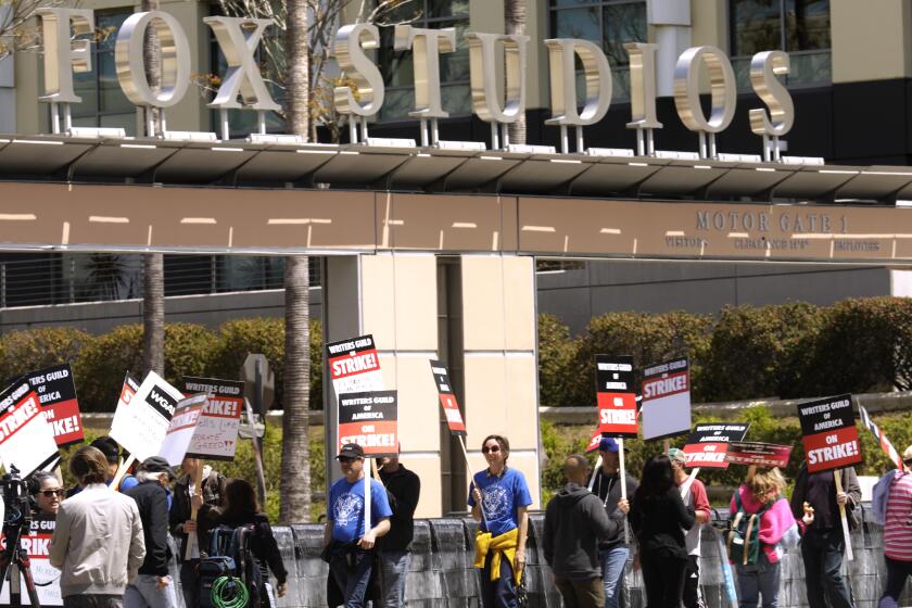 LOS ANGELES, CA - MAY 3, 2023 - WGA members walk the picket line on the second day of their strike in front of Fox Studios along W. Pico Blvd. in Hollywood on May 3, 2023. (Genaro Molina / Los Angeles Times)