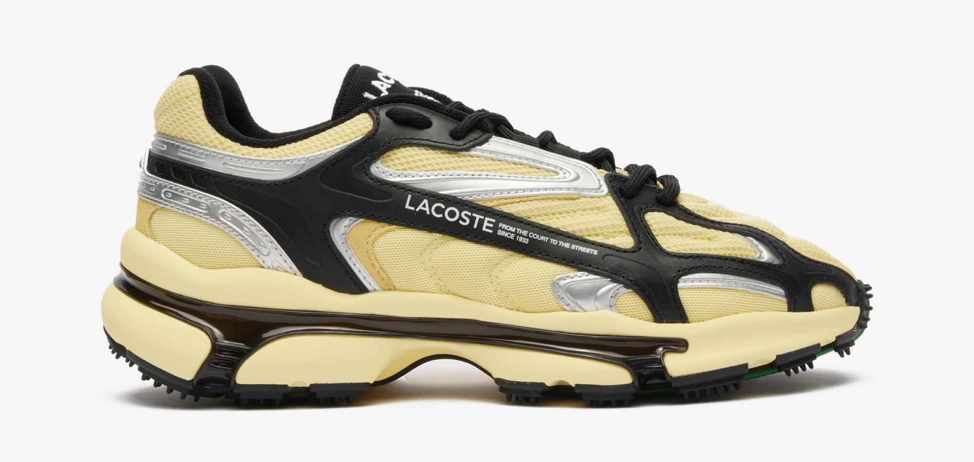 A Lacoste sneakers in a butter yellow color.
