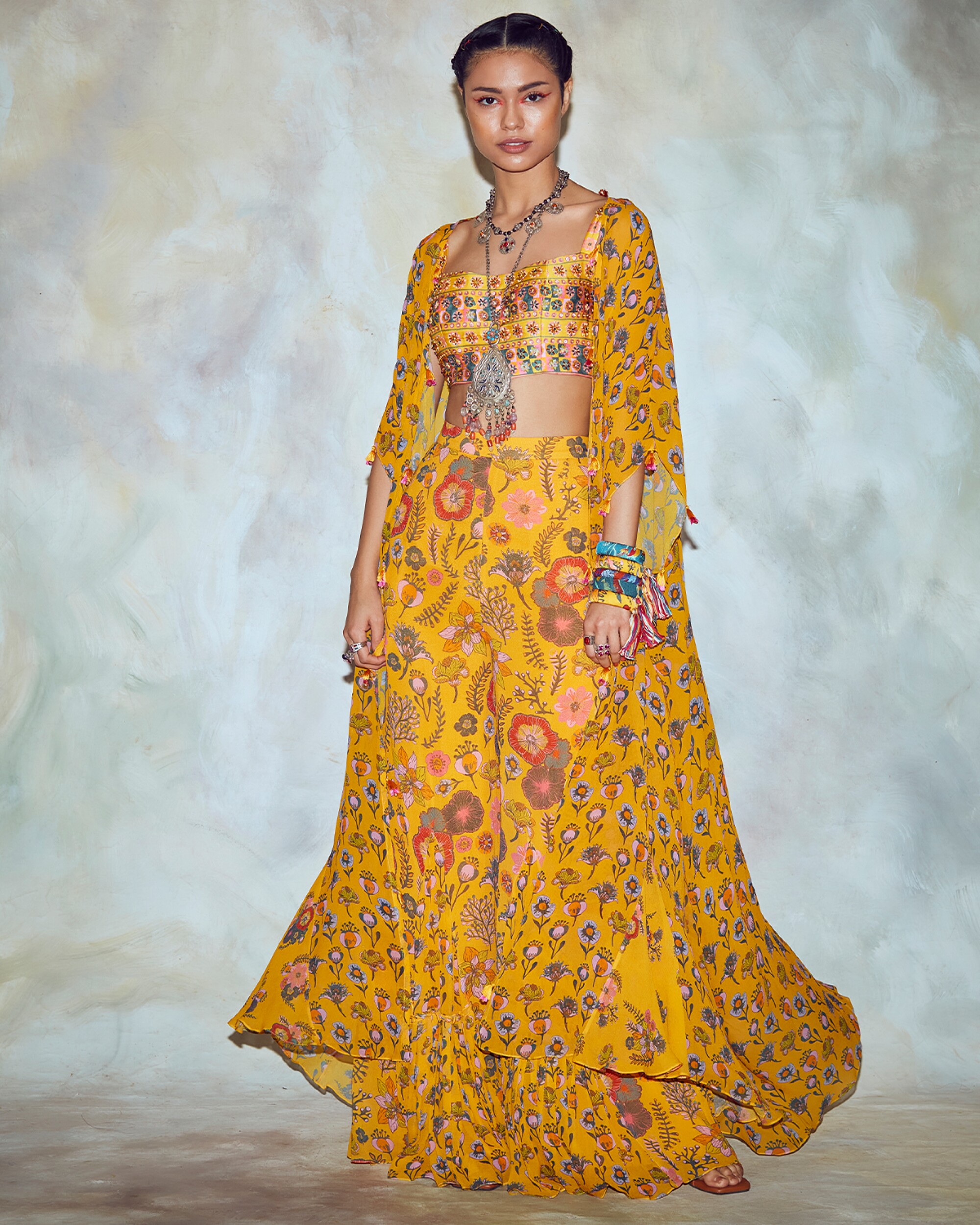 COVETED, Image, issue 09-- Kynah yellow border print cape.