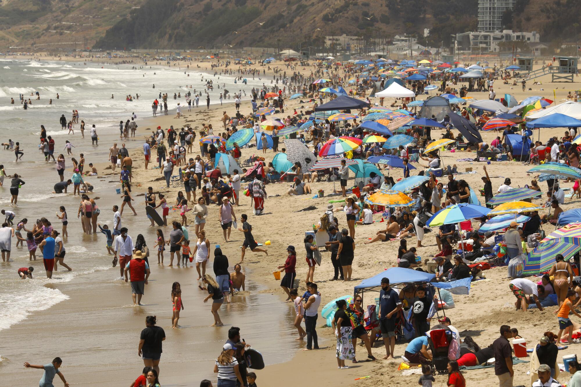 Crowds pack Santa Monica State Beach.