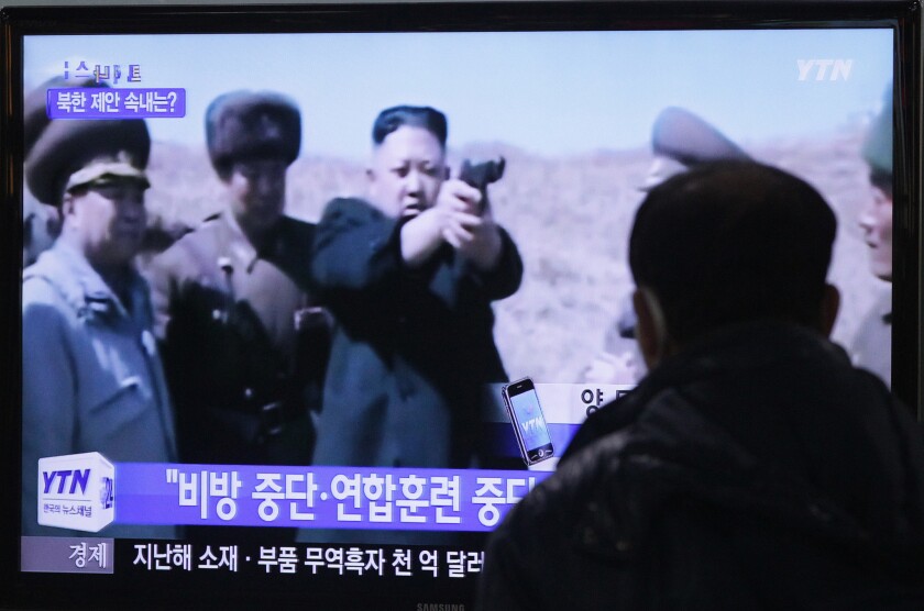 A television monitor at the Seoul Railway Station in the South Korean capital shows North Korean leader Kim Jong Un aiming a gun at an unknown target.