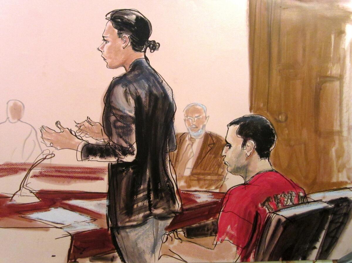 In this courtroom drawing from a hearing last October, Federal Defender Julia Gatto is at left. Seated at right is her client, New York City police officer Gilberto Valle, at Manhattan Federal Court in New York. Valle, who is accused of kidnapping conspiracy, admitted to thinking about abducting, cooking and devouring young women.