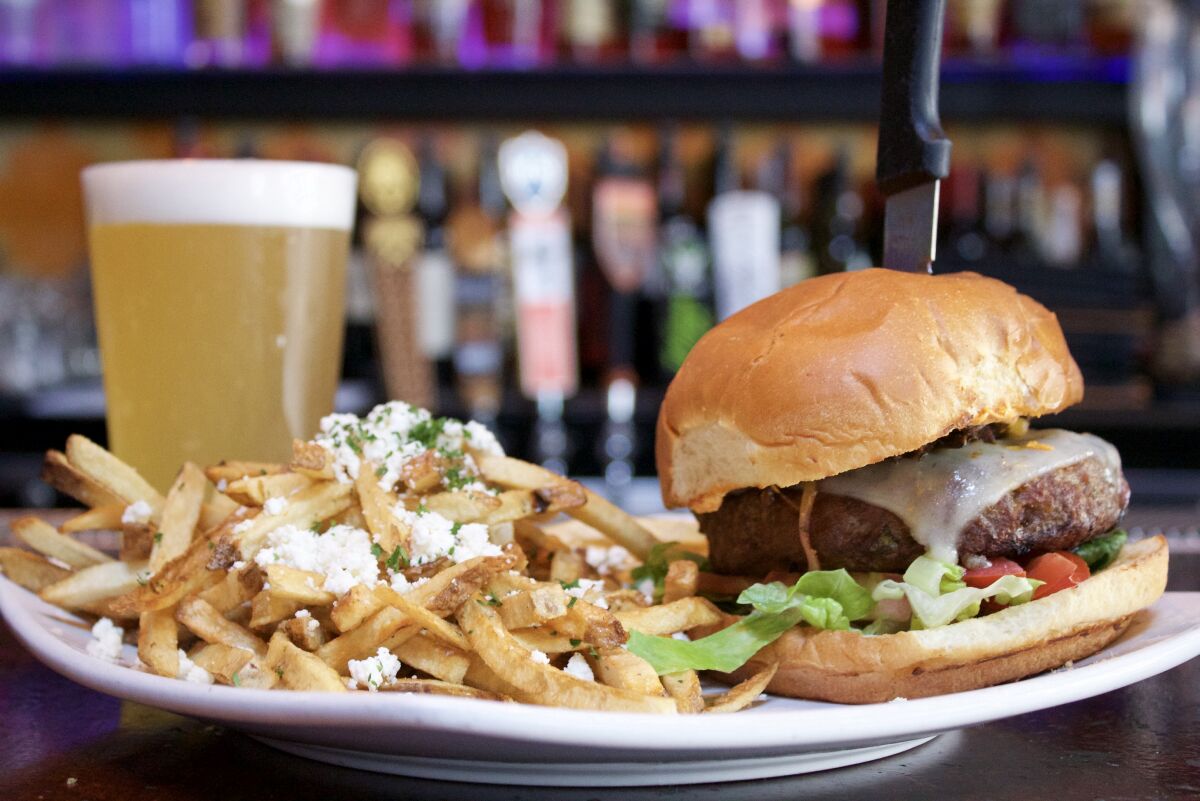 Meze's take on the cheeseburger uses a lot of feta ... even on the fries
