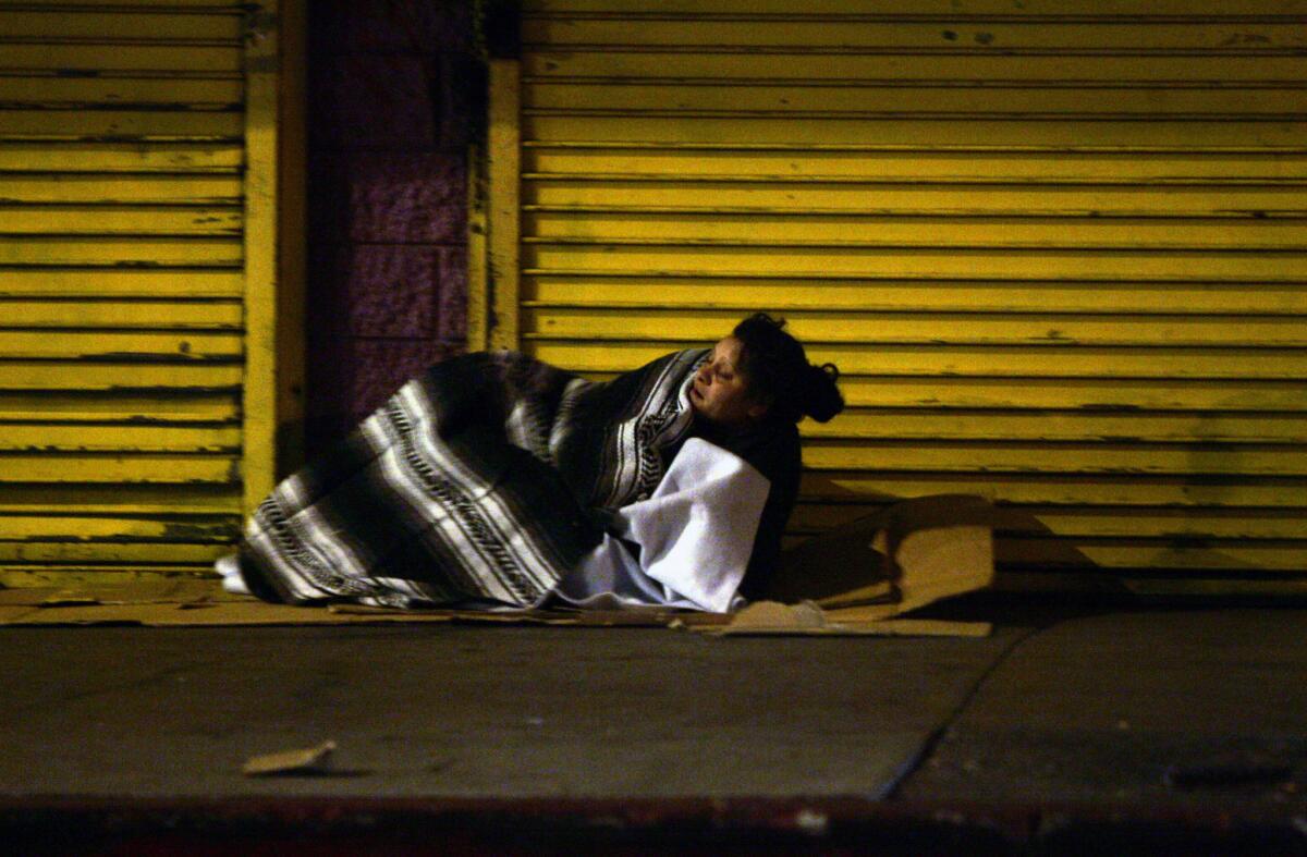A homeless woman on the streets of skid row in downtown Los Angeles.