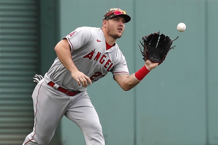 Los Angeles Angels' Mike Trout makes the catch on the line out by Boston Red Sox's J.D. Martinez.