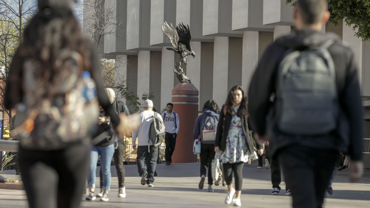 Students walk the campus at California State University, Los Angeles.