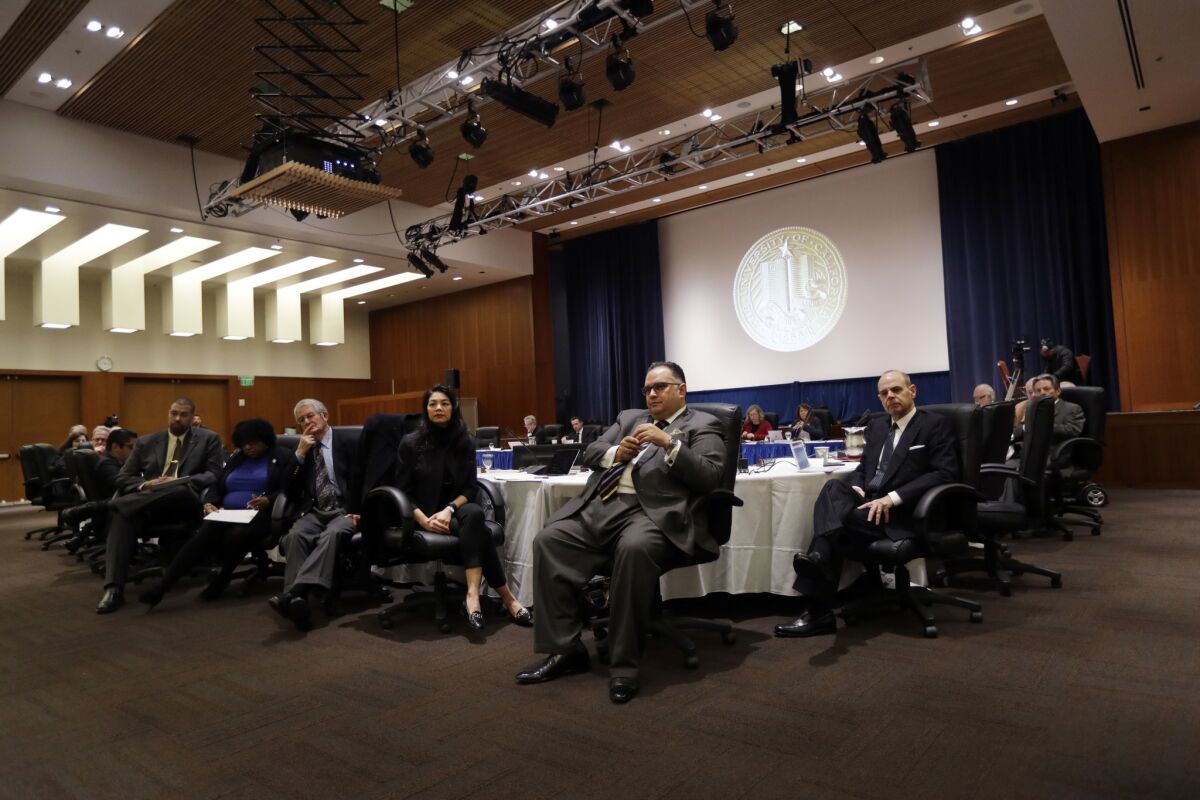 Officials listen to students and UC employees' testimony during a UC regents meeting Jan. 25 in San Francisco.