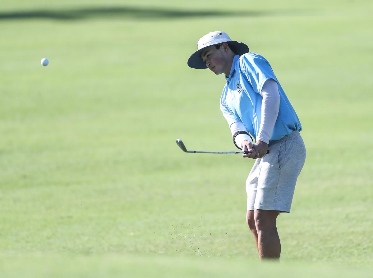 James Leehealey of Corona del Mar hits a chip shot during the Battle of the Bay on Wednesday at Costa Mesa Country Club.