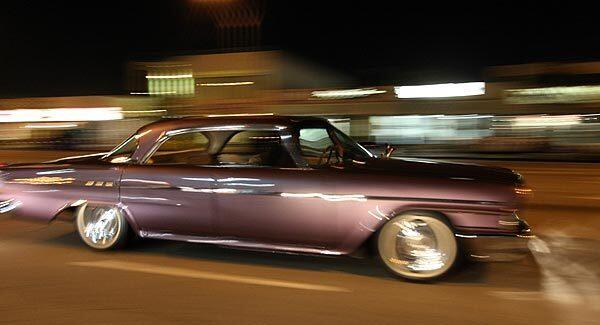 A 1962 Chrysler Newport makes its way down Van Nuys Boulevard during Van Nuys Cruise Night. After 28 long years, cruising has returned to Van Nuys Boulevard.