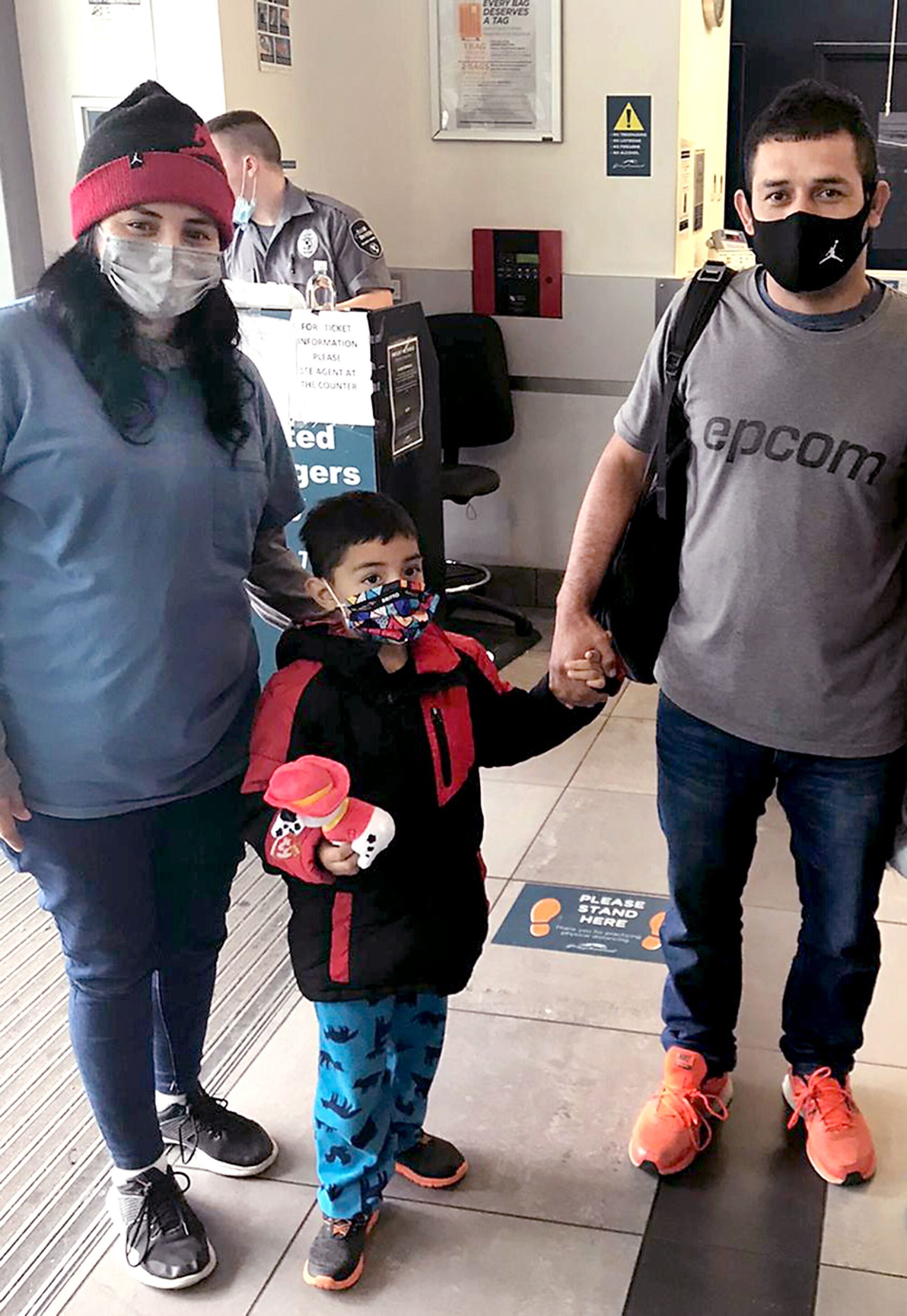A woman and a man with a child.