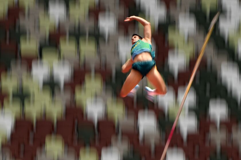 -TOKYO,JAPAN July 31, 2021: Brazil's Augusto Dutra clears the bar in the men's pole vault qualifying at the 2020 Tokyo Olympics. (Wally Skalij /Los Angeles Times)