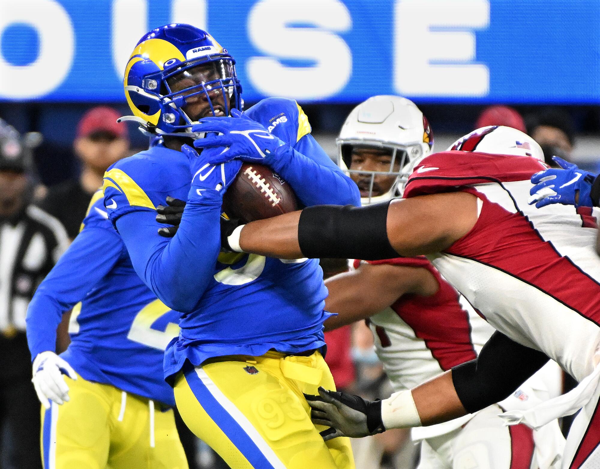 Rams defensive lineman Marquise Copeland intercepts the ball.