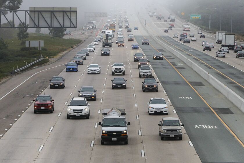 SAN DIEGO, CA - AUGUST 26: Commuters travel during morning commute hours along northbound Interstate 805 (left) north of Governor Drive on Wednesday, Aug. 26, 2020 in San Diego, CA. (Eduardo Contreras / The San Diego Union-Tribune)