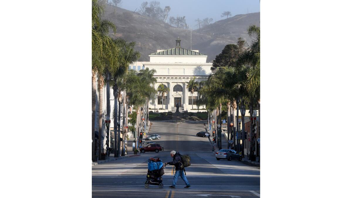 Smoke lingers in the charred hills behind Ventura City Hall.