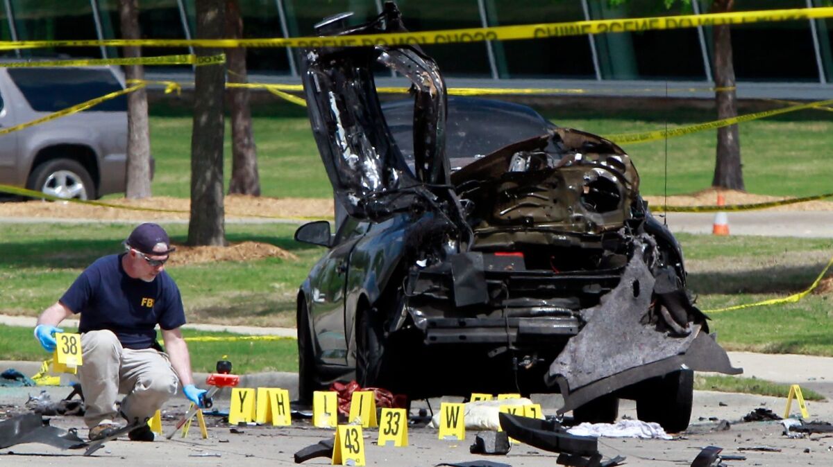 FBI investigators mark a crime scene in Garland, Texas, after two men opened fire at the Muhammad Art Exhibit and Cartoon Contest in 2015. New research shows that guns are involved in fewer than 10% of terrorist attacks, but they cause about 55% of deaths.