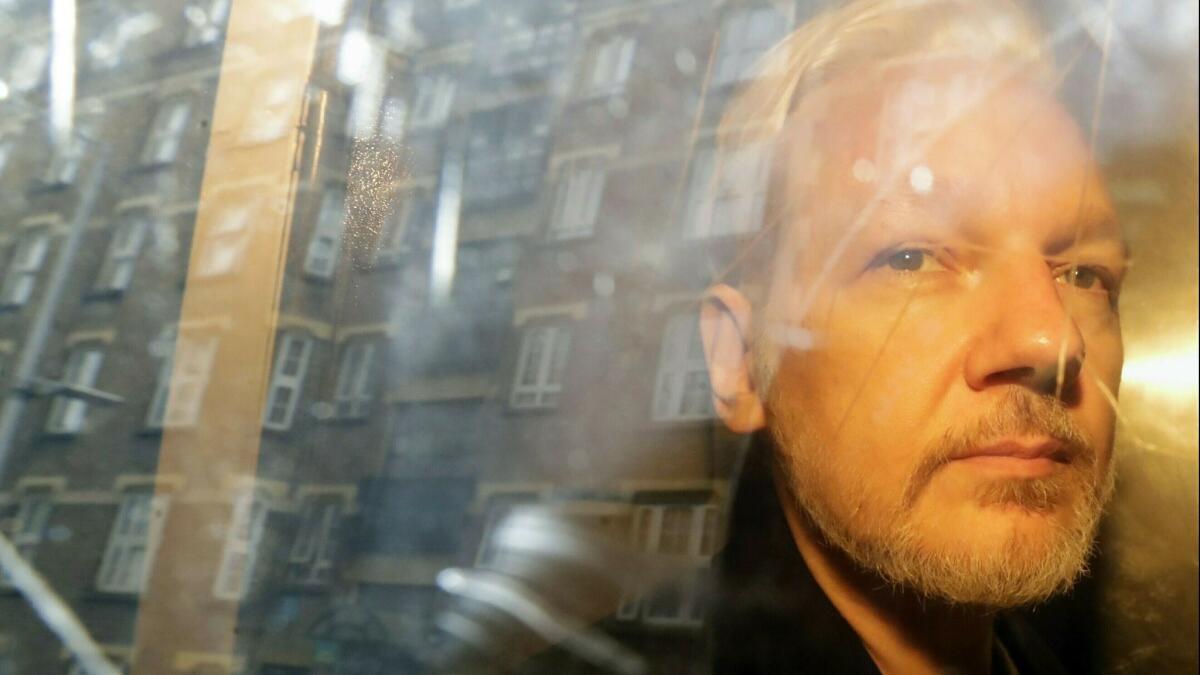 WikiLeaks founder Julian Assange is taken from court on May 1 in London.