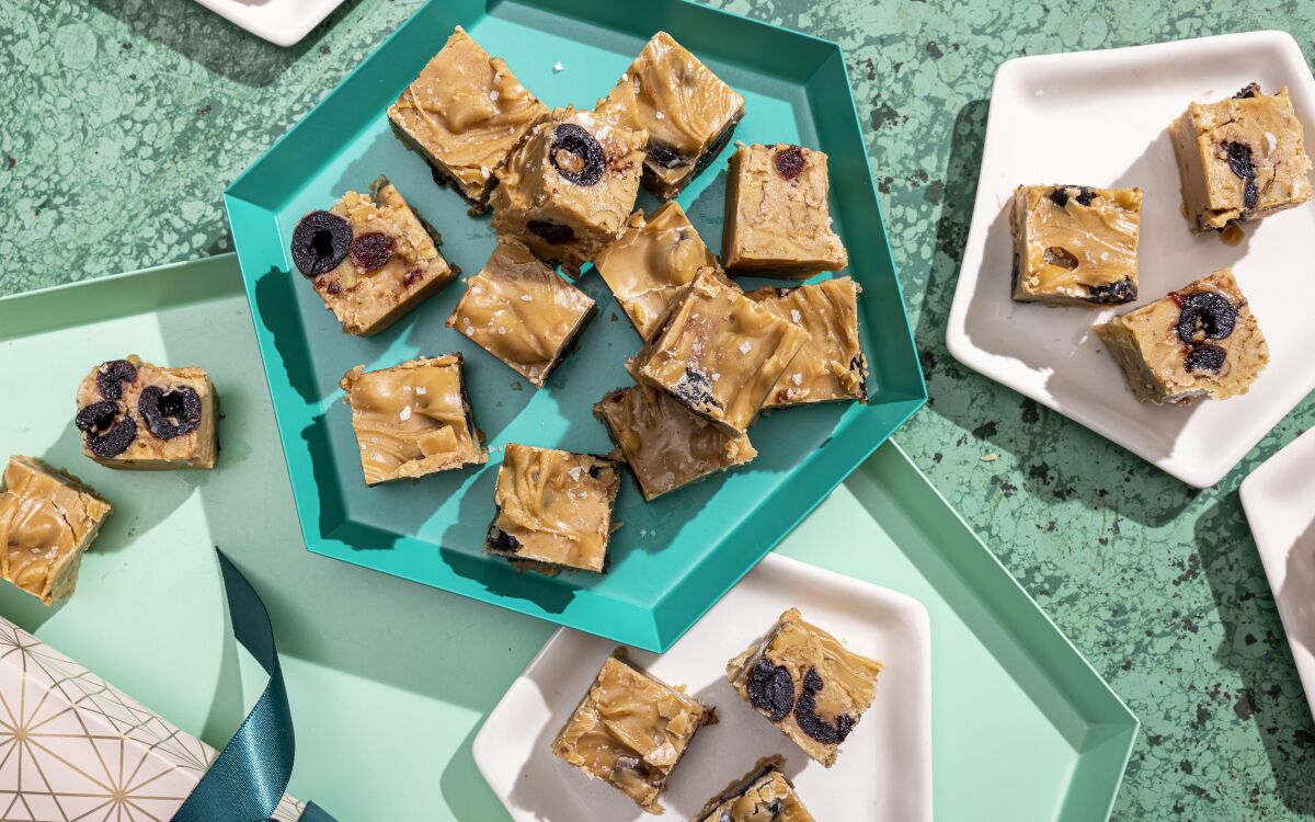 Coconut milk and cream add richness to this vegan fudge, which is teeming with toasted walnuts and candied cherries.