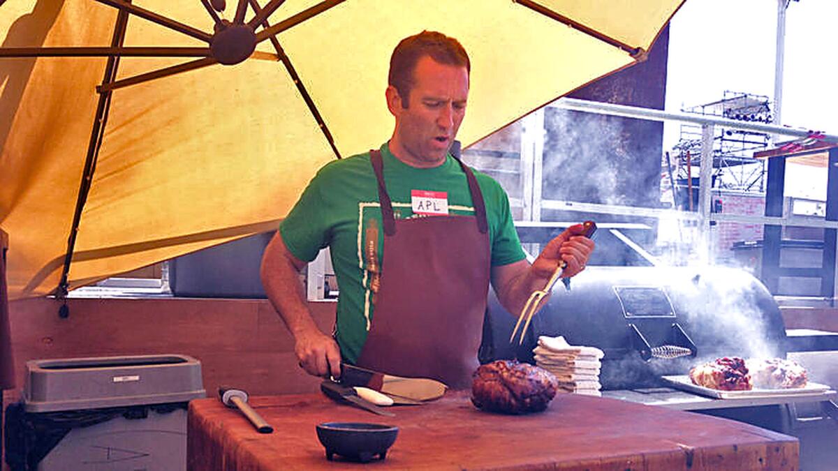Adam Perry Lang cooks in a parking lot behind the El Capitan Theatre in Hollywood.