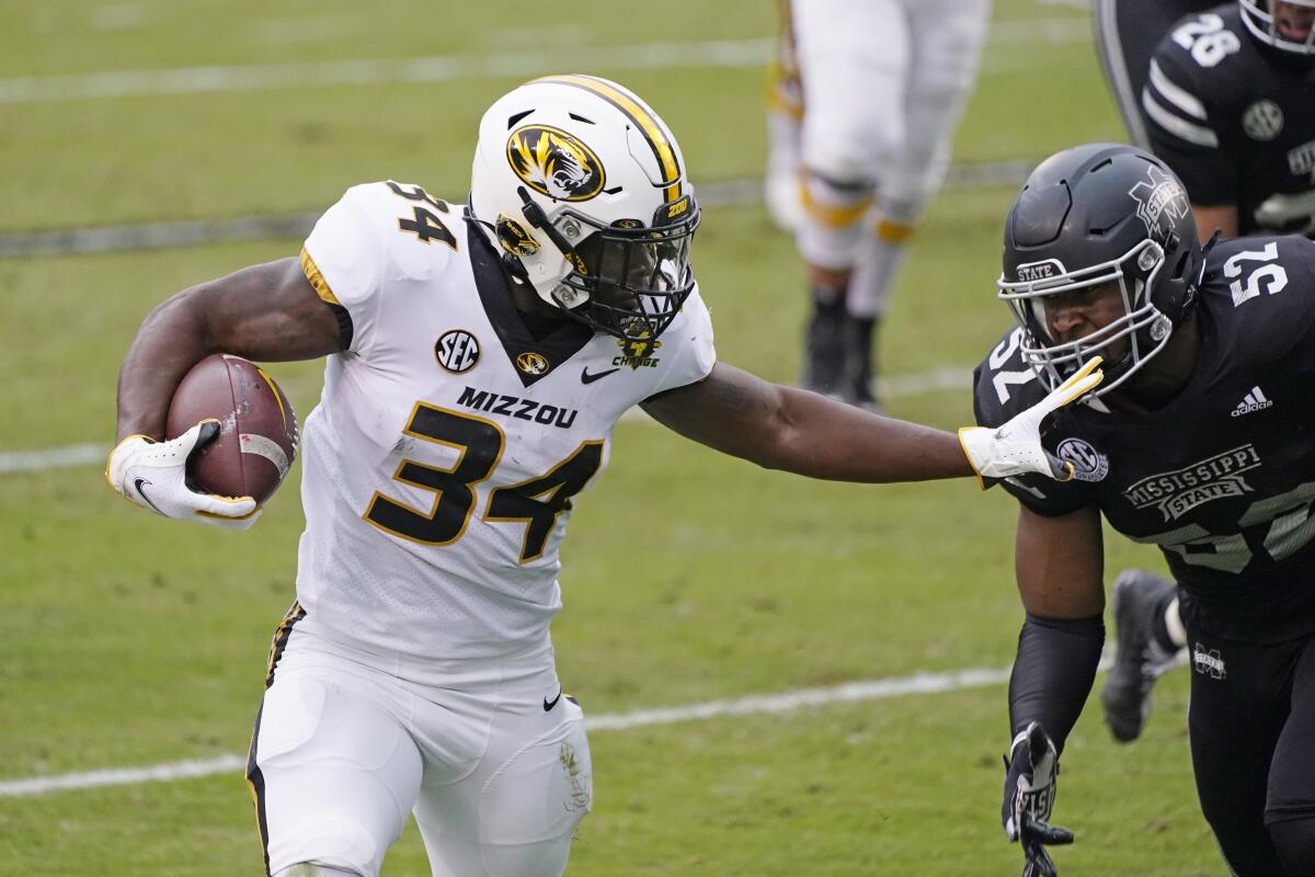 Missouri running back Larry Rountree III (34) fights off an attempted tackle against Mississippi State.